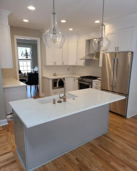Modern kitchen with white cabinets and large island