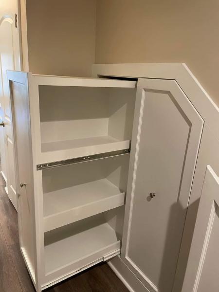 Built in storage cabinets under stairs