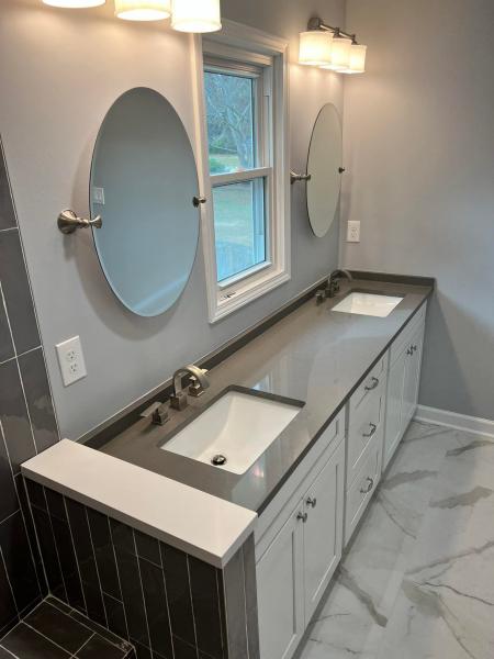 Double bathroom vanity with round mirrors