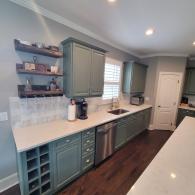 Kitchen renovation with gray cabinets and white countertops