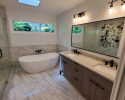 Modern, luxury bathroom with double vanity and soaking tub