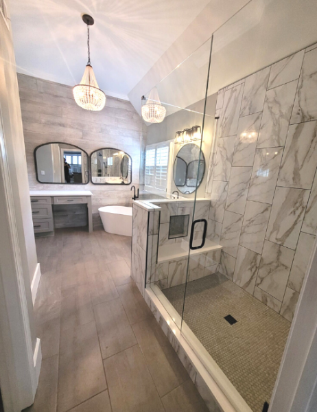 Large glass shower with marble tile