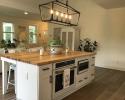 Butcher block island with oven and microwave