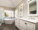Newly renovated bathroom with large double vanity and soaking tub