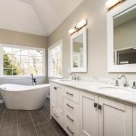 Newly renovated bathroom with large double vanity and soaking tub