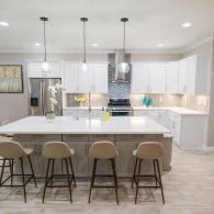 Modern, all white kitchen with large island