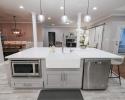 Kitchen island with luxury farmhouse sink and built in microwave
