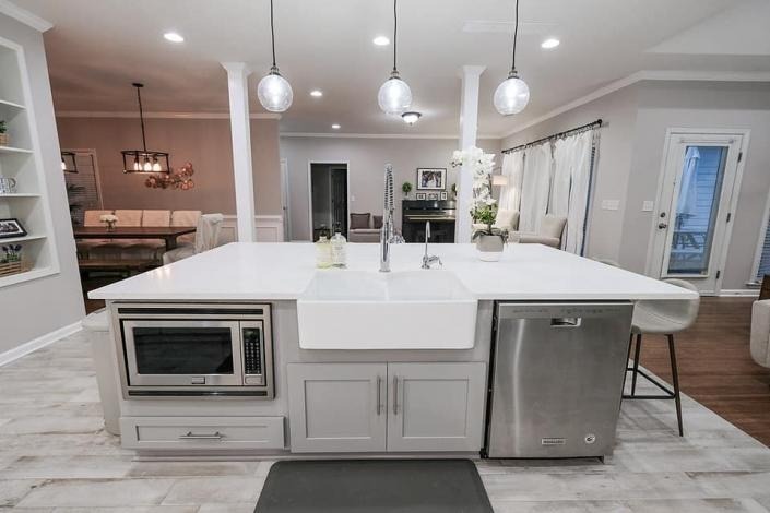 Kitchen island with luxury farmhouse sink and built in microwave